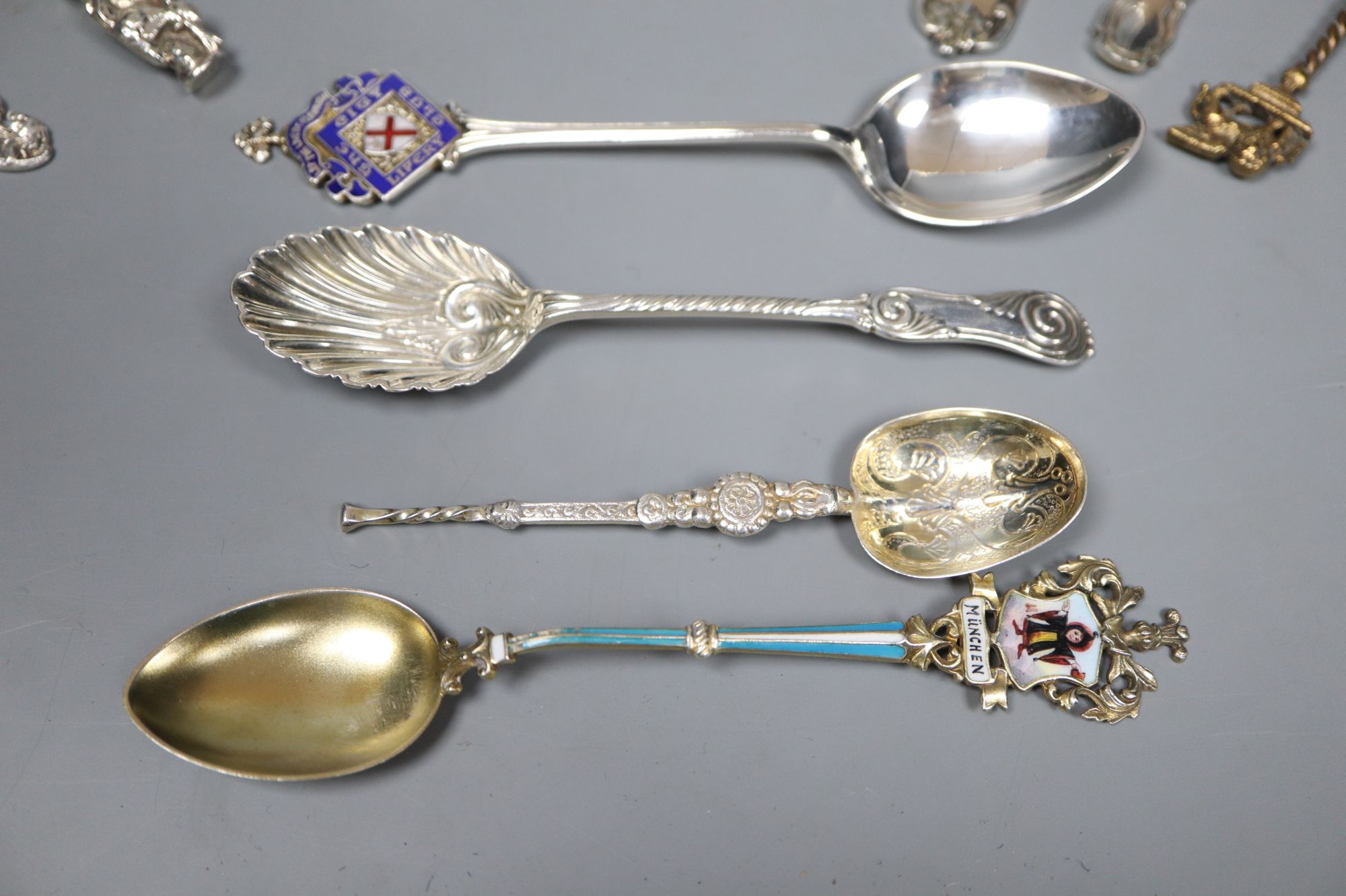 An ornate Edwardian silver gilt spoon, 22cm, ten other assorted silver spoons including continental and silver and two small